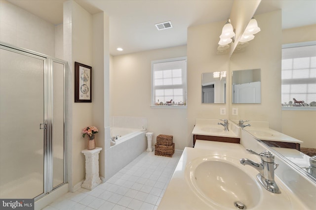 44516 Blueridge Meadows Dr, Ashburn, VA 20147 - bathroom featuring a sink, tile patterned flooring, a shower stall, and visible vents