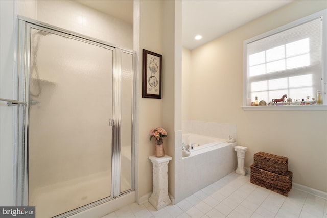 44516 Blueridge Meadows Dr, Ashburn, VA 20147 - full bathroom with tile patterned floors, baseboards, a garden tub, and a stall shower