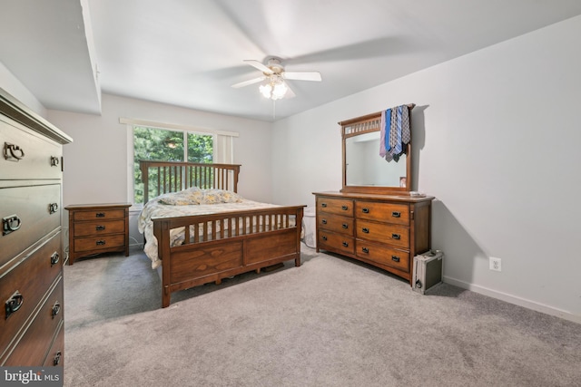 bedroom featuring baseboards, a ceiling fan, and carpet flooring