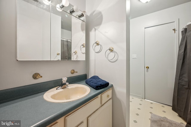 bathroom featuring tile patterned floors and vanity