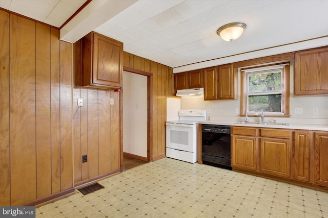 kitchen with wooden walls, a sink, black dishwasher, light floors, and white electric range