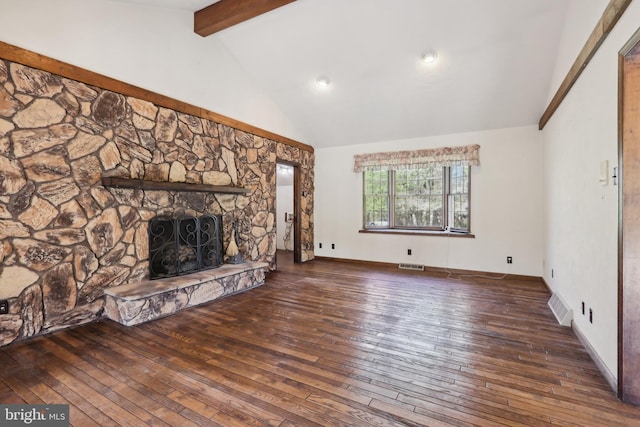 unfurnished living room featuring visible vents, a fireplace, hardwood / wood-style floors, and beamed ceiling