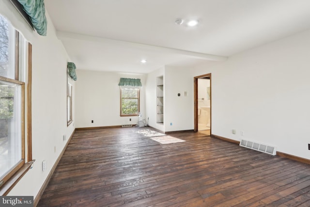 spare room featuring recessed lighting, baseboards, visible vents, and hardwood / wood-style floors