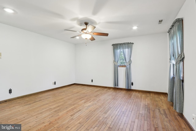 unfurnished room featuring a ceiling fan, visible vents, baseboards, light wood finished floors, and recessed lighting