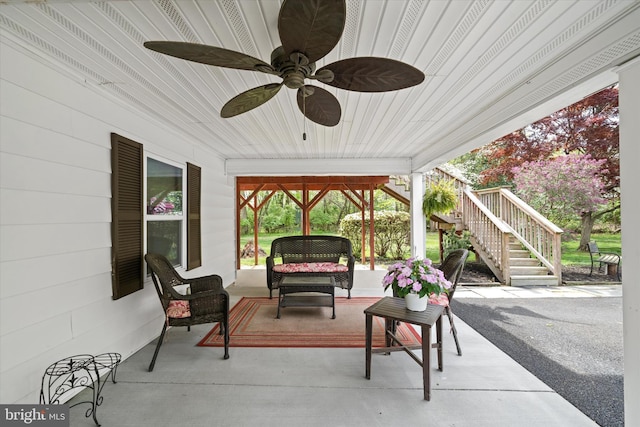 view of patio featuring an outdoor hangout area, a ceiling fan, and stairway