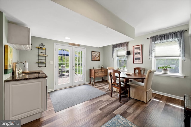 dining room with baseboards, dark wood-style flooring, and french doors
