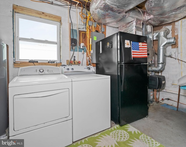 laundry room featuring washing machine and dryer and electric panel