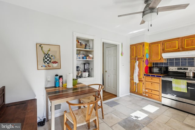 947 Old York Rd, Hightstown, NJ 08520 - kitchen featuring stainless steel electric range, under cabinet range hood, black microwave, tile counters, and a ceiling fan