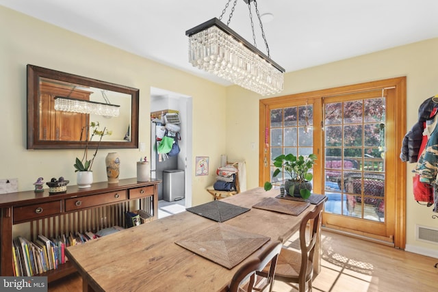 947 Old York Rd, Hightstown, NJ 08520 - dining area with a chandelier and light wood-type flooring