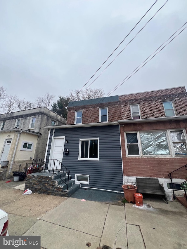 exterior space with brick siding
