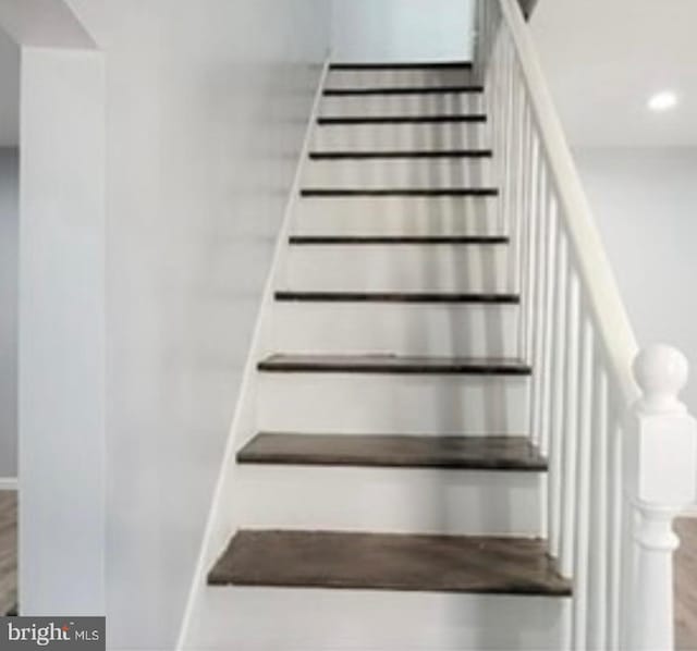 stairs with recessed lighting, baseboards, and wood finished floors