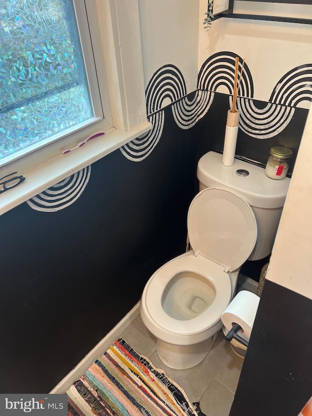 bathroom featuring tile patterned floors and toilet