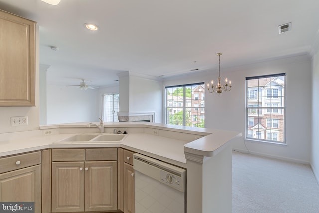kitchen with light brown cabinets, ornamental molding, a sink, and dishwasher