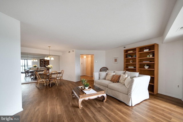 3310 N Leisure World Blvd Unit 1019, Silver Spring, MD 20906 - living room with wood finished floors and a chandelier