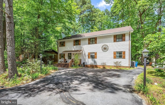 9 Sailors Way, Berlin, MD 21811 - view of front of home with a chimney, a wooden deck, and aphalt driveway