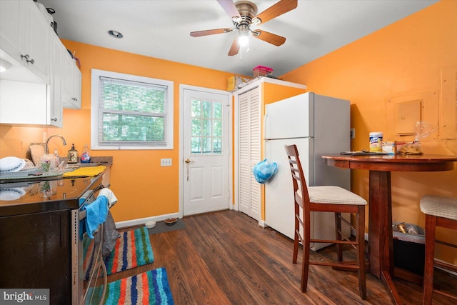9 Sailors Way, Berlin, MD 21811 - kitchen with freestanding refrigerator, a sink, baseboards, dark wood-style floors, and electric stove