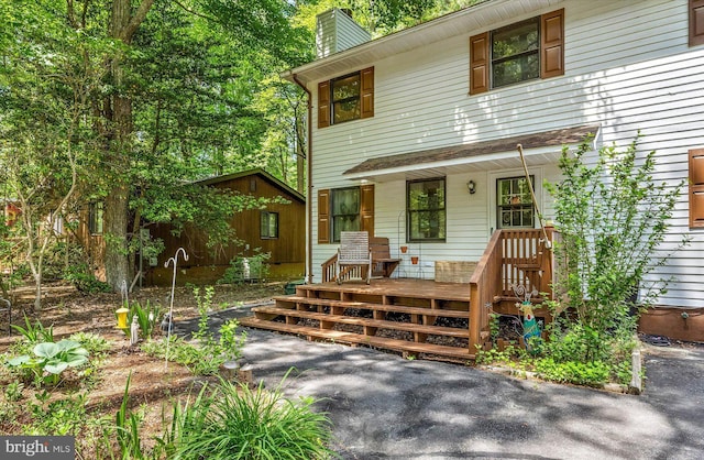 9 Sailors Way, Berlin, MD 21811 - view of front of house with a porch and a chimney