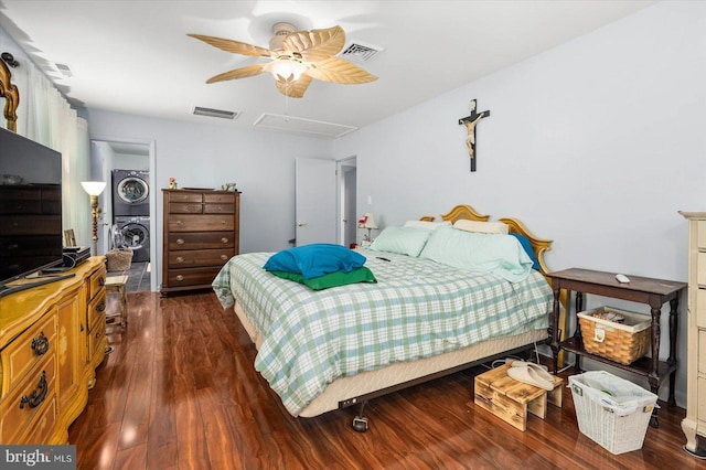 9 Sailors Way, Berlin, MD 21811 - bedroom with dark wood-style flooring, visible vents, and stacked washer and clothes dryer