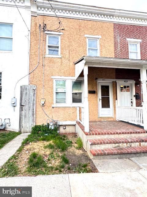 entrance to property with brick siding