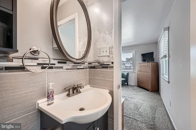 3646 Double Rock Ln, Baltimore, MD 21234 - bathroom featuring baseboards, tasteful backsplash, and vanity
