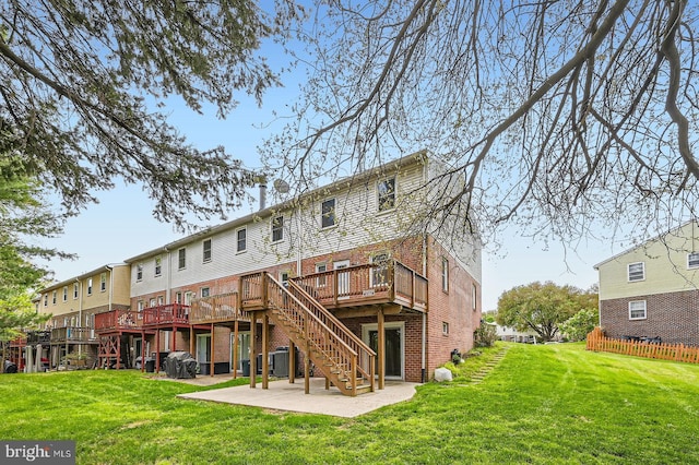 3646 Double Rock Ln, Baltimore, MD 21234 - rear view of property featuring a lawn, brick siding, stairway, and a wooden deck