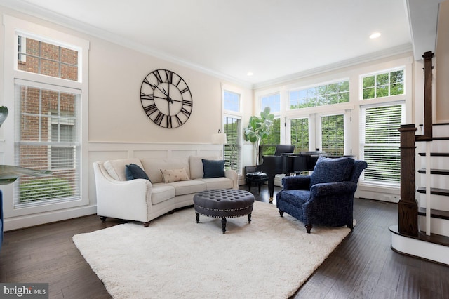 living room featuring ornamental molding, dark wood finished floors, a wainscoted wall, and recessed lighting