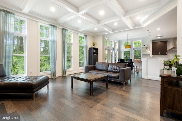 living room featuring dark wood finished floors, plenty of natural light, beamed ceiling, coffered ceiling, and recessed lighting
