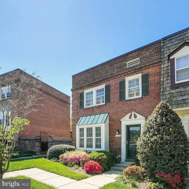 multi unit property featuring brick siding