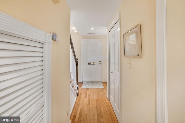 hallway featuring recessed lighting and light wood-style floors