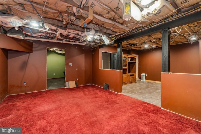 unfinished below grade area featuring tile patterned flooring