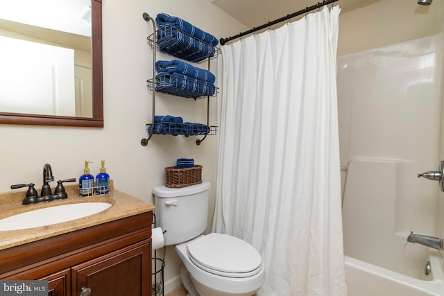 full bathroom featuring vanity, shower / bathtub combination with curtain, and toilet
