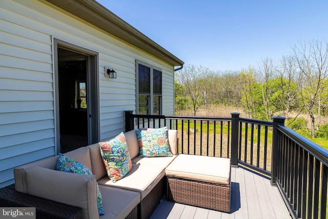 wooden terrace with outdoor lounge area