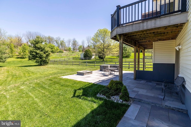 view of yard featuring fence, a patio, an outdoor fire pit, and a wooden deck