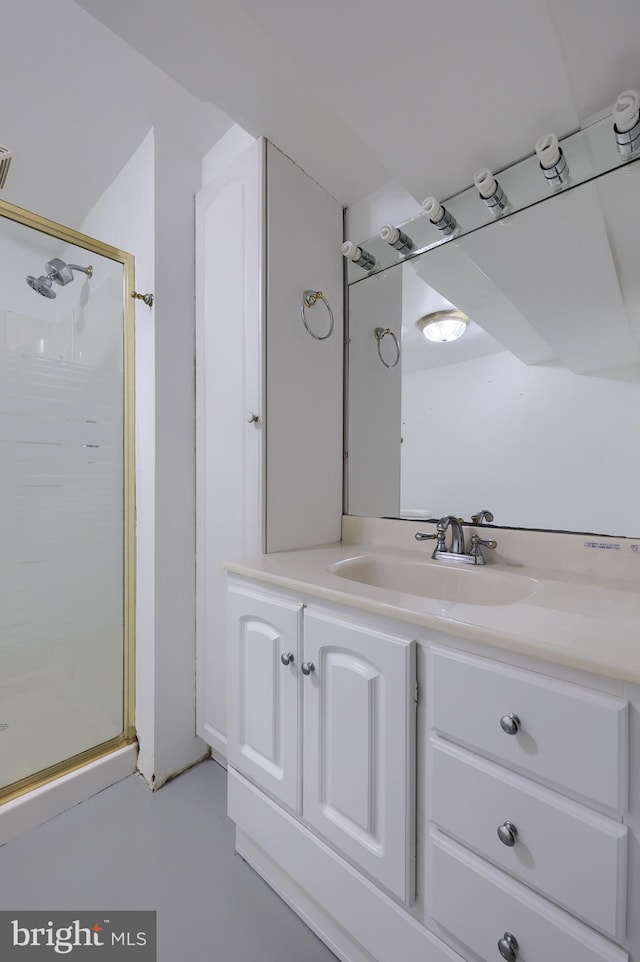 bathroom with vanity and a shower stall