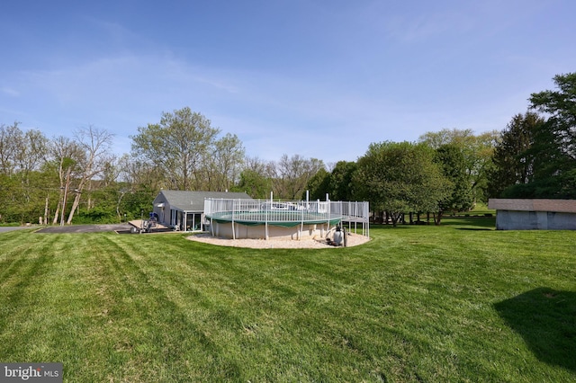 view of yard featuring an outdoor pool