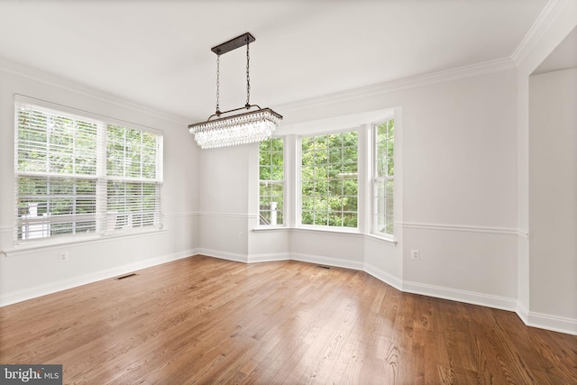 609 Smartts Ln NE, Leesburg, VA 20176 - spare room with ornamental molding, baseboards, hardwood / wood-style floors, and plenty of natural light