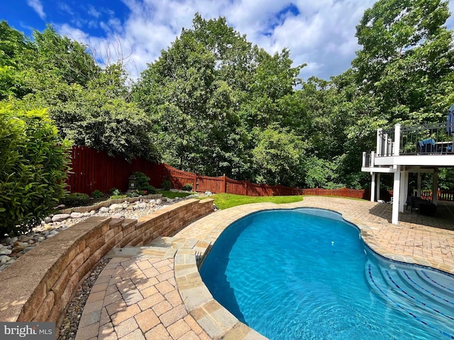 view of pool featuring a patio area and a fenced backyard
