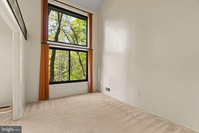 carpeted empty room with visible vents