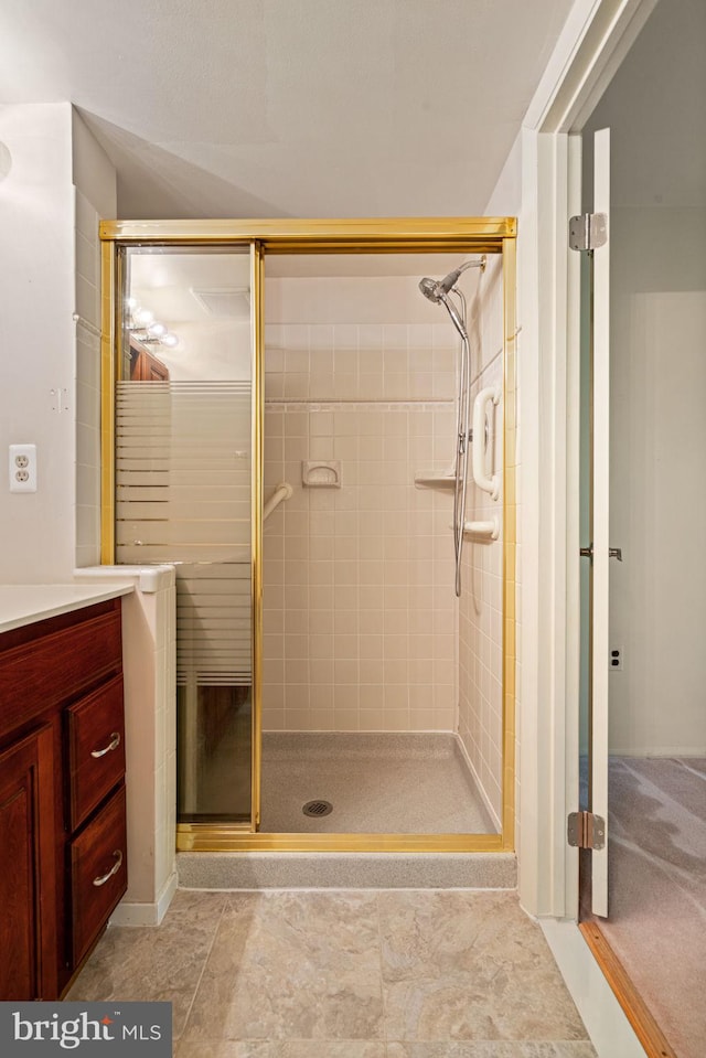 bathroom with a shower stall
