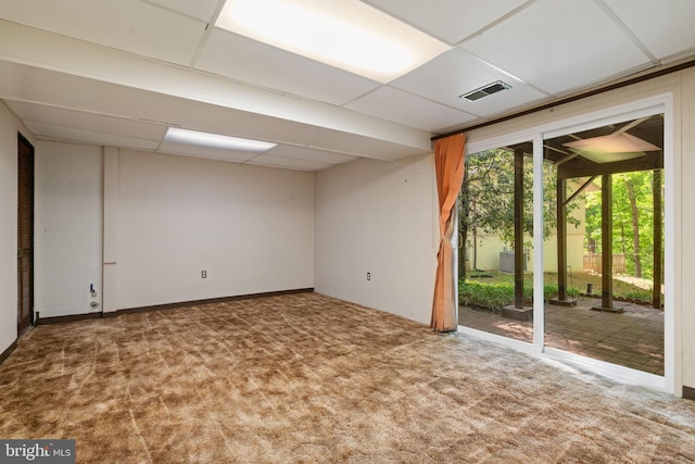 empty room with carpet flooring and visible vents