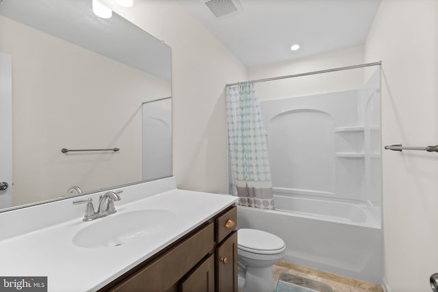 bathroom with vanity, toilet, visible vents, and shower / bath combo with shower curtain