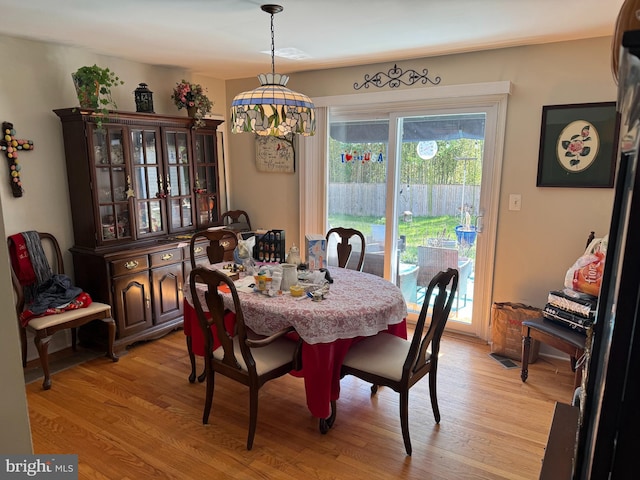 dining area with light wood-type flooring
