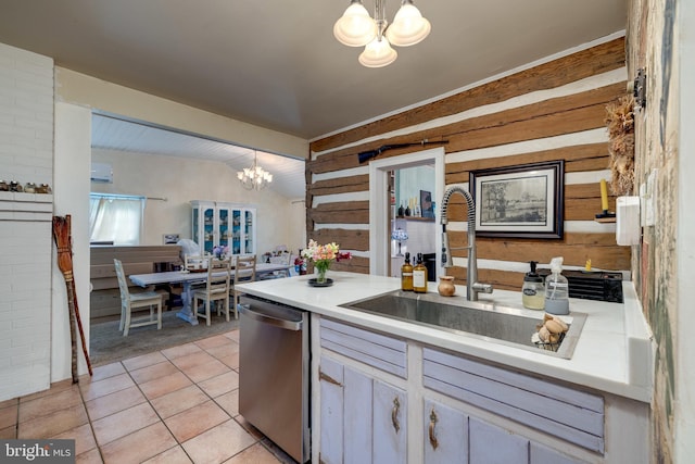3909 Stoney Creek Rd, Edinburg, VA 22824 - kitchen featuring stainless steel dishwasher, a chandelier, a sink, wood walls, and light countertops