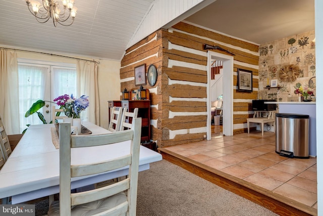 3909 Stoney Creek Rd, Edinburg, VA 22824 - carpeted dining space featuring a chandelier, stairs, lofted ceiling, wood walls, and wallpapered walls