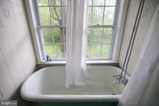 3909 Stoney Creek Rd, Edinburg, VA 22824 - full bath with tile walls and a tub to relax in