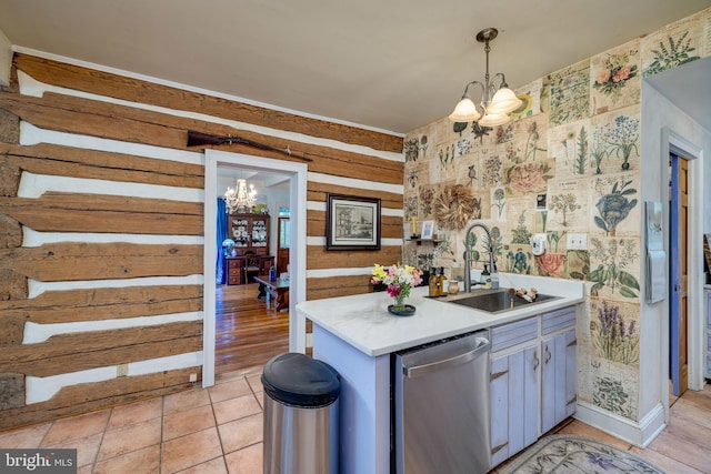 3909 Stoney Creek Rd, Edinburg, VA 22824 - kitchen featuring dishwasher, a chandelier, a sink, light countertops, and hanging light fixtures