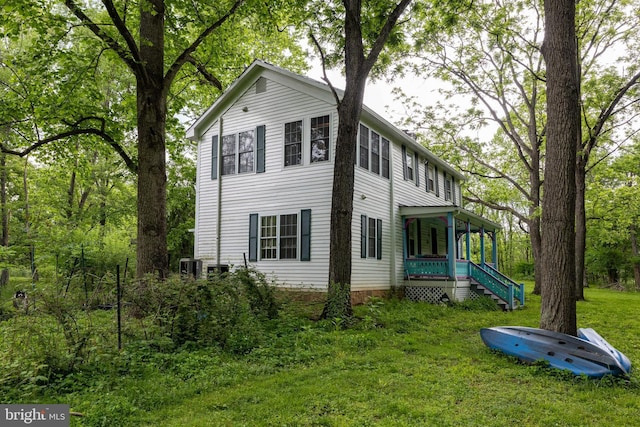 3909 Stoney Creek Rd, Edinburg, VA 22824 - view of front of home with a front yard, central AC unit, and a porch