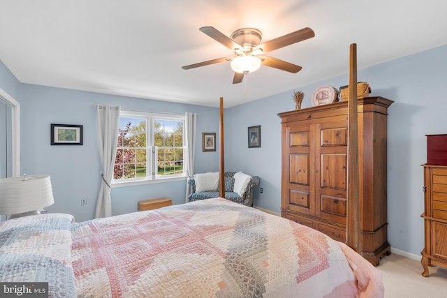 bedroom featuring a ceiling fan and light carpet