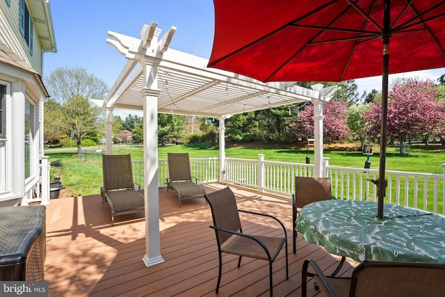 deck with a lawn, a pergola, and outdoor dining space