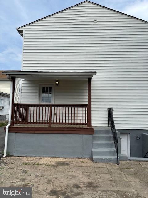 back of house with covered porch